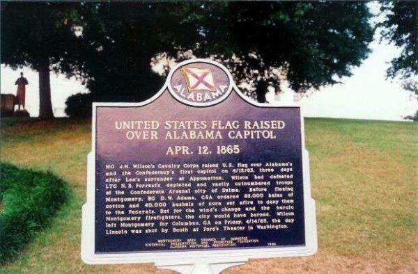 UNITED STATES FLAG RAISED OVER ALABAMA CAPITOL MEMORIAL MARKER